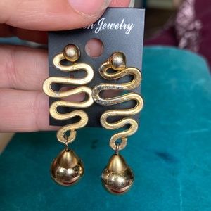 Vintage, gold in color, dangling earrings